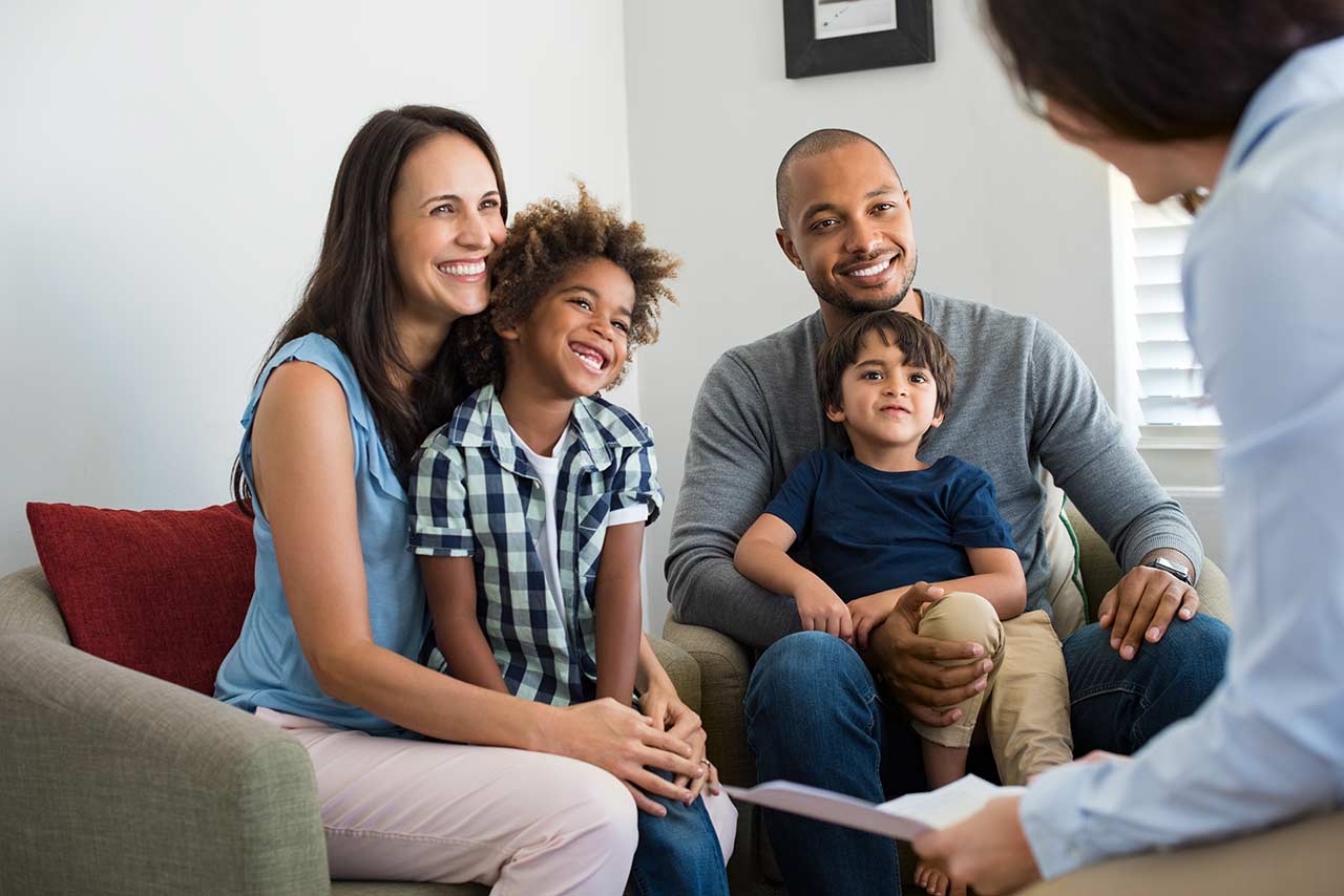 Parents and children talking with a therapist